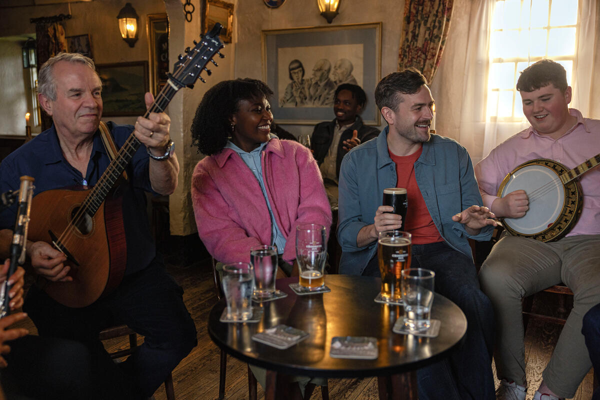 Group of musicians sitting at the Crosskeys Inn